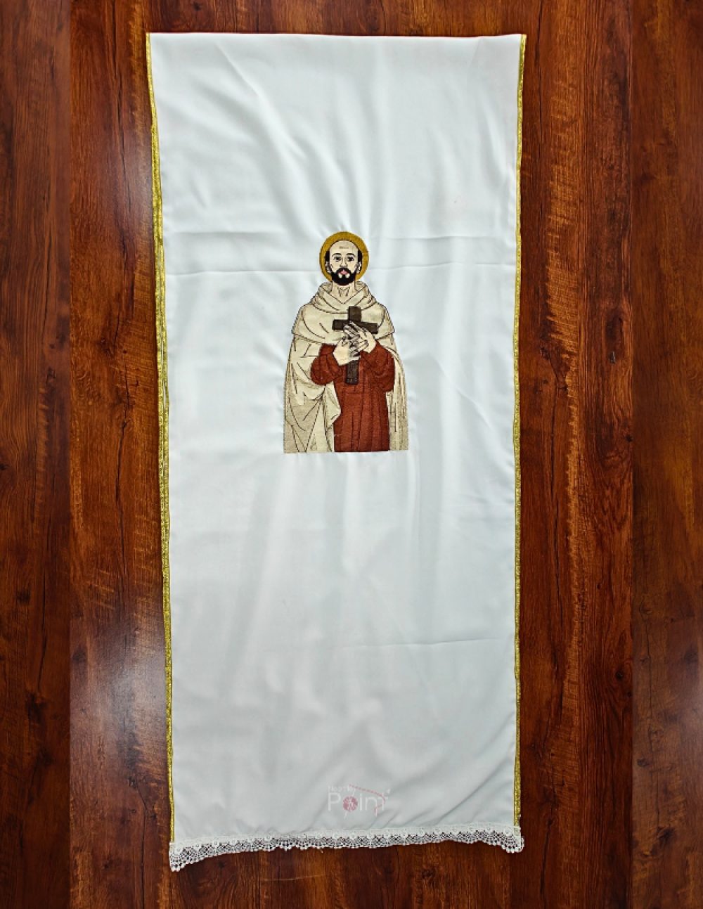 Flat lay view of white lectern fall machine-embroidered with St. John of the Cross holding a wooden cross