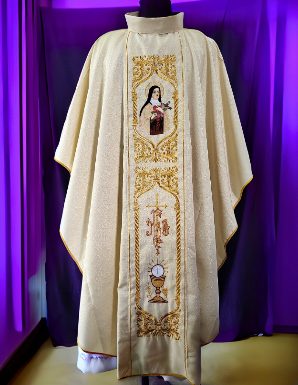 Front view of golden chasuble with saint motif and Eucharistic chalice orphrey panel – Needle Point